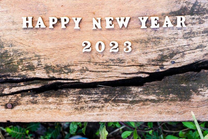 Happy New Year 2023 Concept. Wood Text on Old Wooden Plank Stock Image