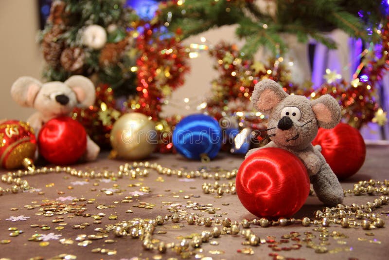 Happy New Year 2020! gray rat with red ball on a gold background. Merry Christmas. stock images