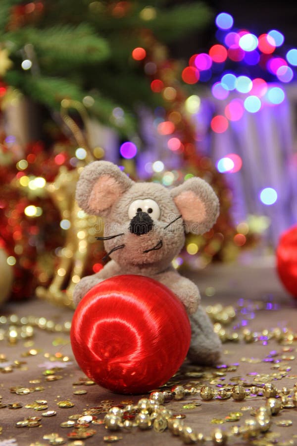 Happy New Year 2020. A gray rat and a red ball. The year of the rat. The rat symbol of the year. stock photography