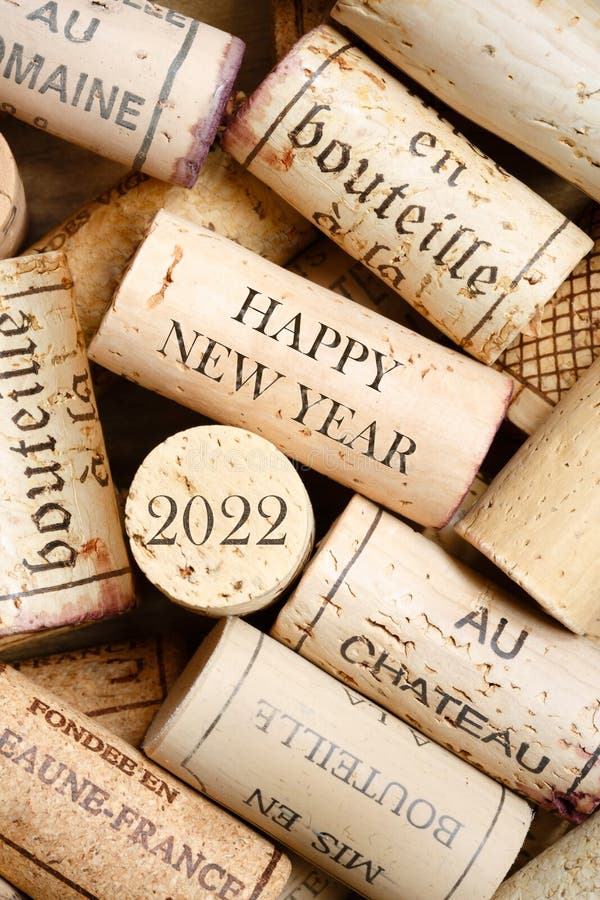 Happy New Year 2022. Greeting card with wine corks. No visible trademarks stock photos Happy New Year 2022. Greeting card with wine corks. No visible trademarks stock photos