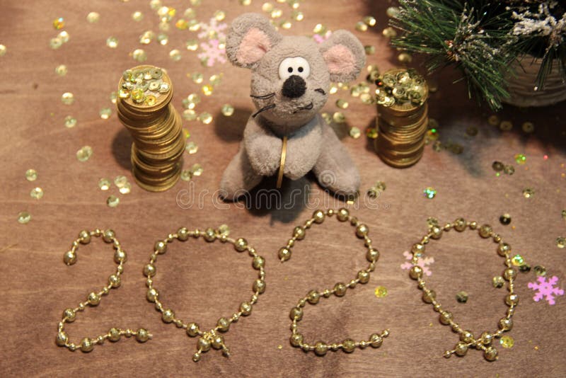 Happy New Year 2020. Grey rat and money, wishes for wealth and profit. Golden background. Merry Christmas. royalty free stock images