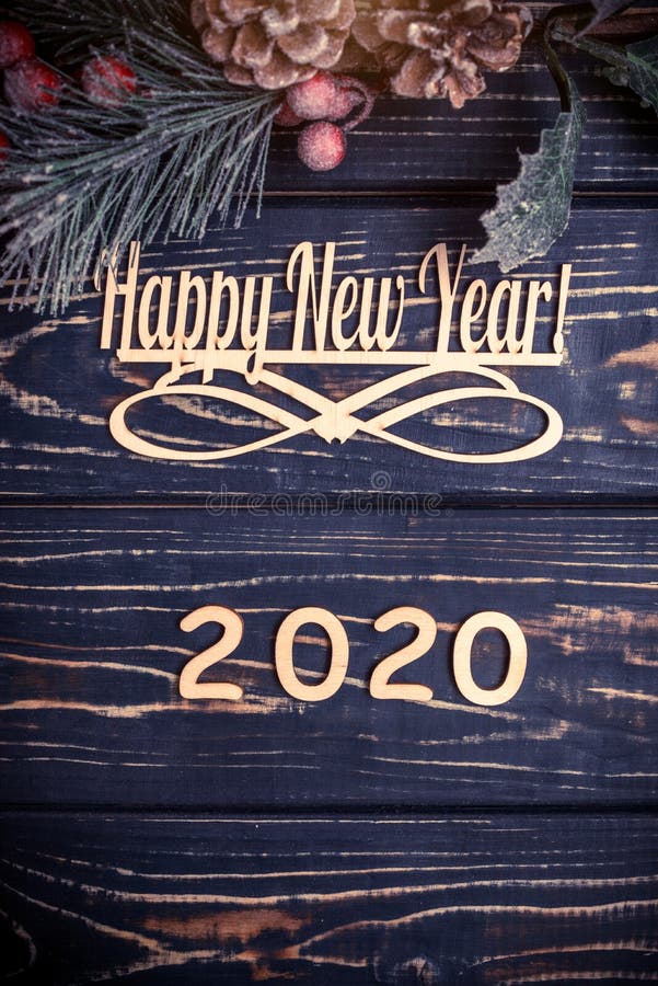 Happy new year 2020. On wooden brown background royalty free stock photos