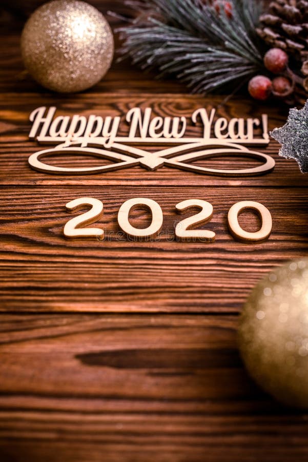 Happy new year 2020. On wooden brown background stock images