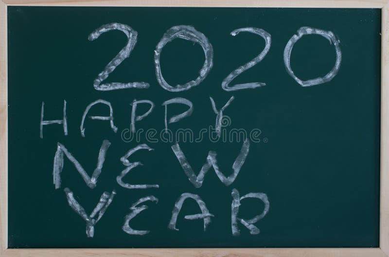 Happy new year 2020 message. On a blackboard, track, nobody, drawing, christmas, date, winter, nature, season, outdoors, frost, trace, surface, trail, written royalty free stock photography