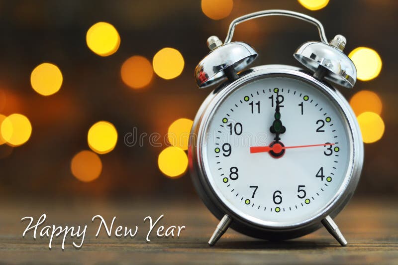 Happy New Year. Midnight clock and blurred lights stock photography Happy New Year. Midnight clock and blurred lights stock photography