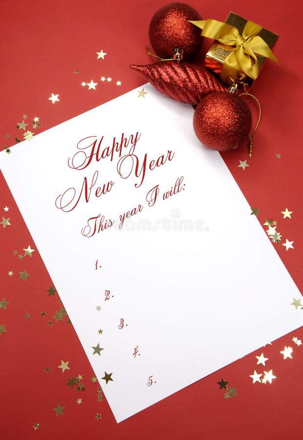 Happy New Year resolutions writing on notepad paper