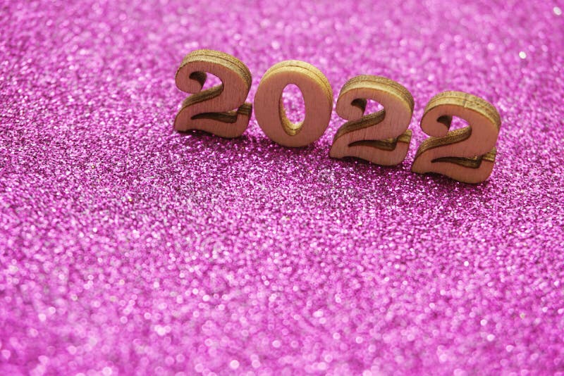 Happy New year 2022 with space copy on purple glitter background. Top view of Happy New year 2022 with space copy on purple glitter background stock photography