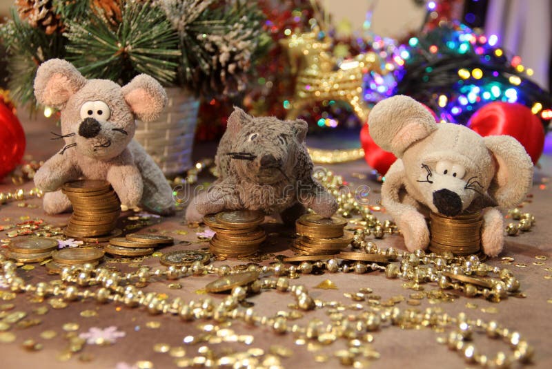 Happy New Year 2020! Three gray rats with coins on a gold background. Merry Christmas. stock images