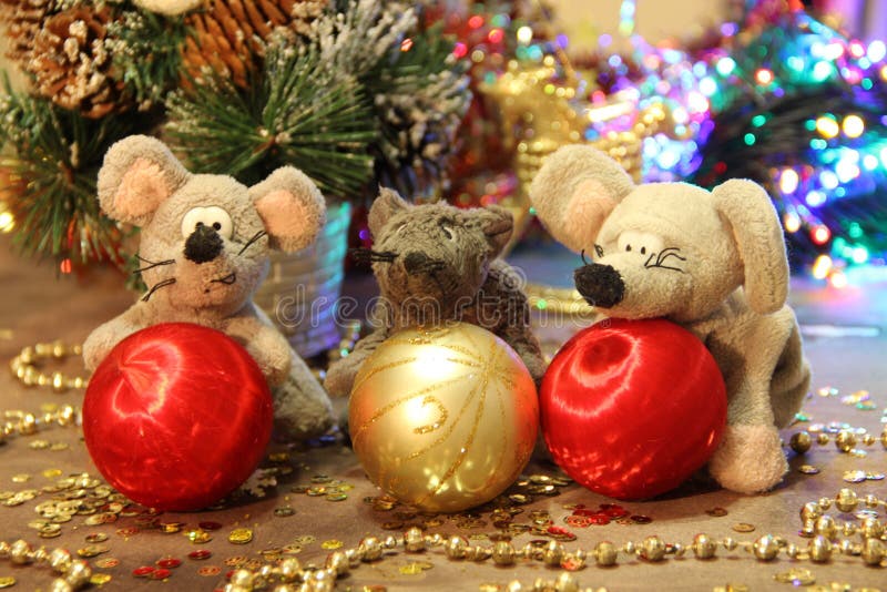 Happy New Year 2020! Three gray rats with red balls on a gold background. Merry Christmas. stock images