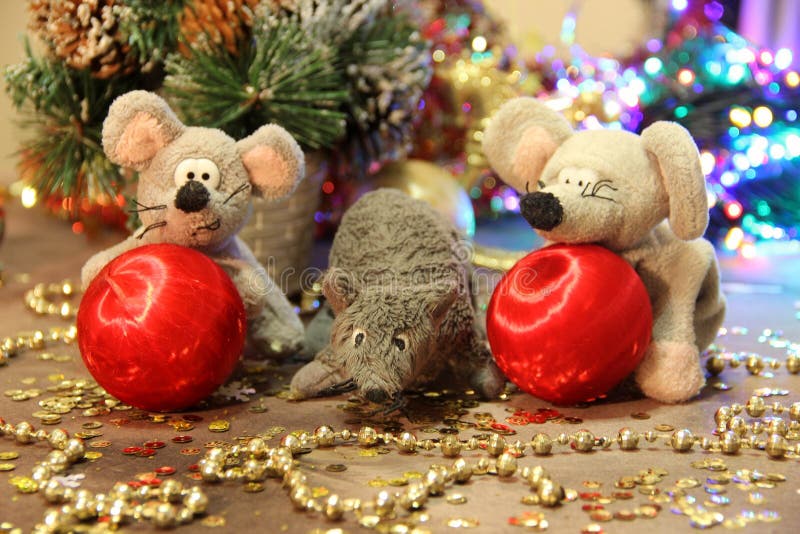 Happy New Year 2020! Three gray rats with red balls on a gold background. Merry Christmas. stock photos