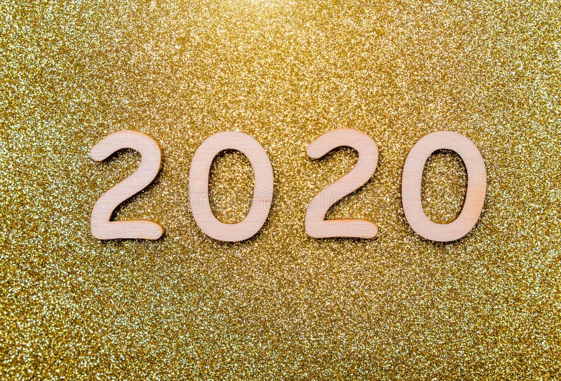 Happy new year 2020. On wooden golden background royalty free stock image