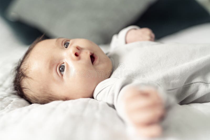 A Happy Newborn Baby on the Bed at Home Stock Image Image of peaceful