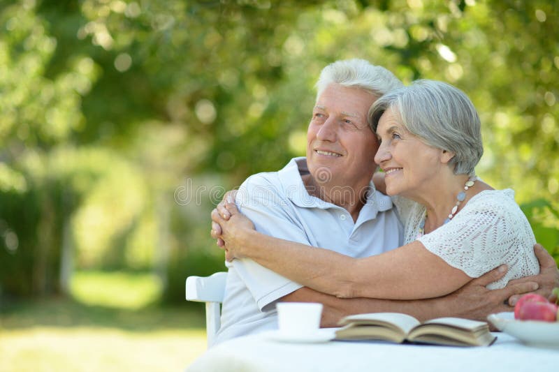 Happy old couple with drink