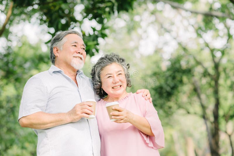 Happy older couple drink coffee together