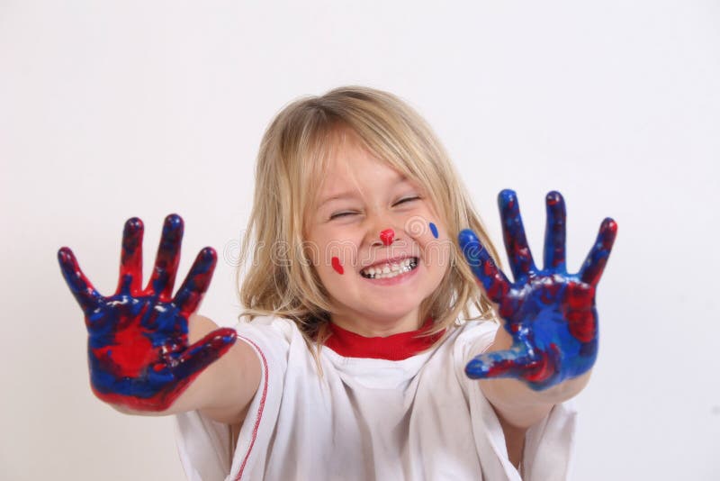 A cute little girl who got into the paints. A cute little girl who got into the paints.