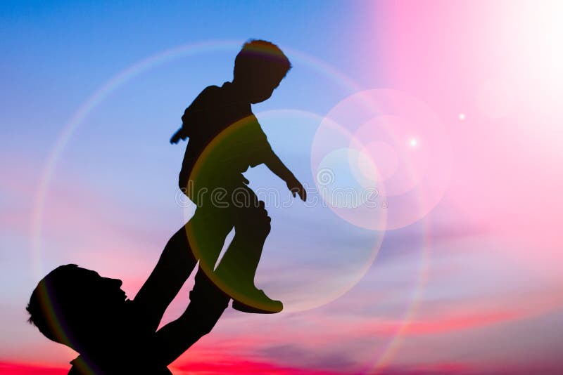 Happy parent with children playing on nature summer silhouette