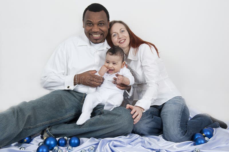 Happy parents and baby boy stock image. Image of happiness - 25176491