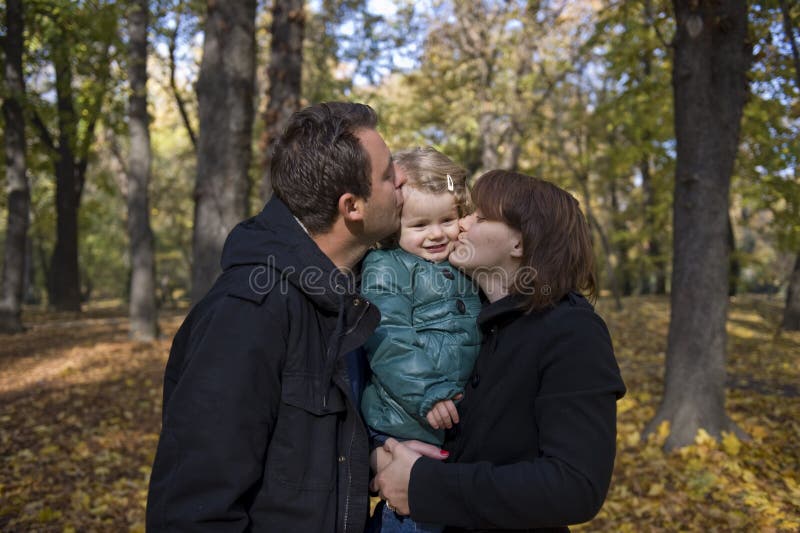 Happy parents and little girl