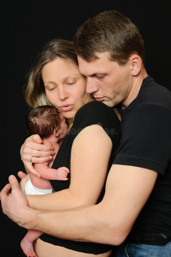 Happy parents with a newborn girl