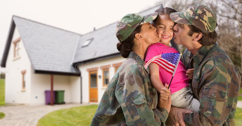 Happy parents in soldiers uniform kissing their daughter stock image Happy parents in soldiers uniform kissing their daughter stock image