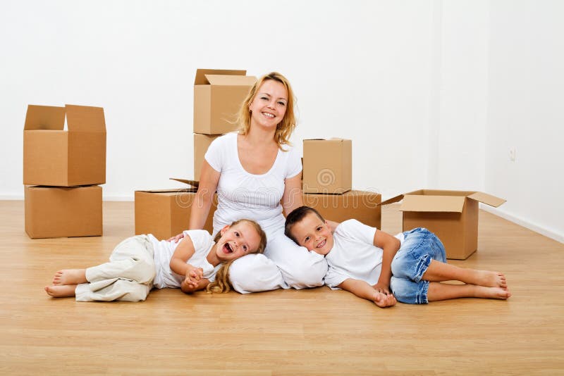 Happy people moving into a new house stock photo Happy people moving into a new house stock photo