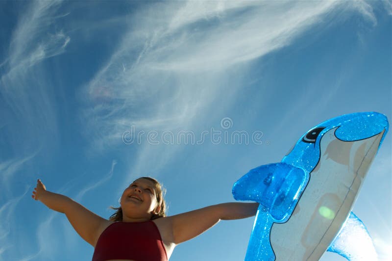 Happy plump Girl and dolphin stock photos
