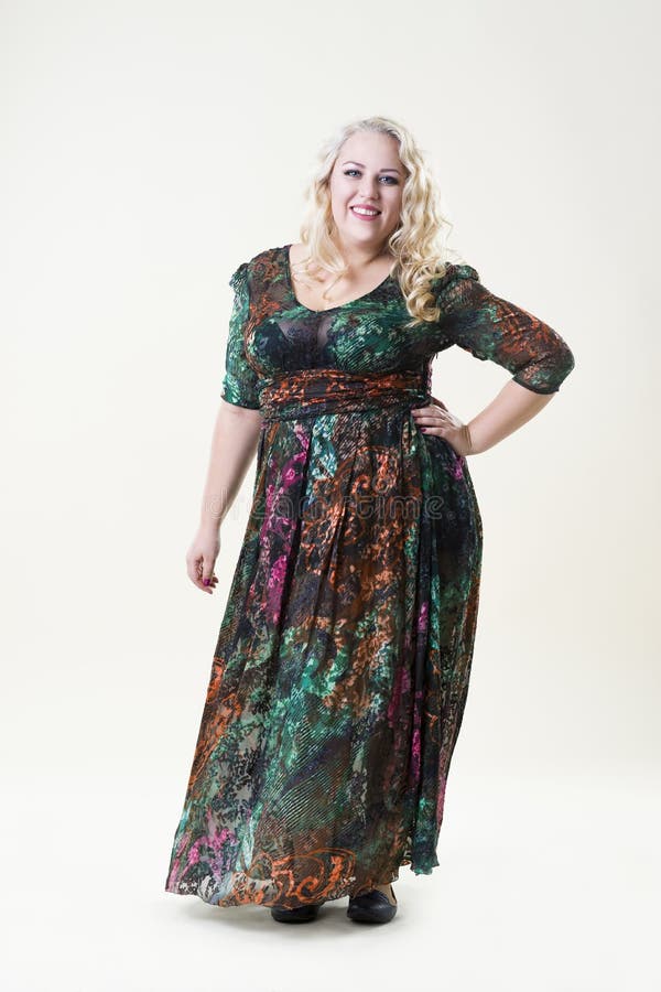Happy Plus Size Fashion Model, Fat Woman on Beige Background Stock
