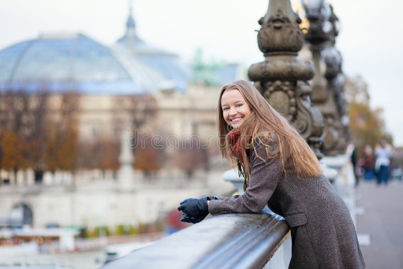 Happy positive girl on the Pont Alexandre III