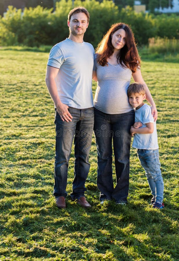 Happy Pregnant Family of Three Expecting New Baby Stock Image - Image ...