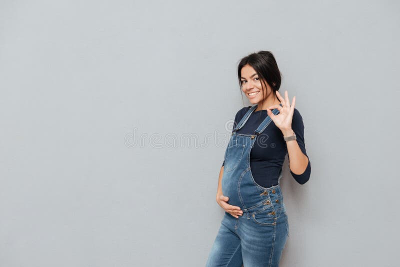 Happy pregnant lady make okay gesture stock photography Happy pregnant lady make okay gesture stock photography