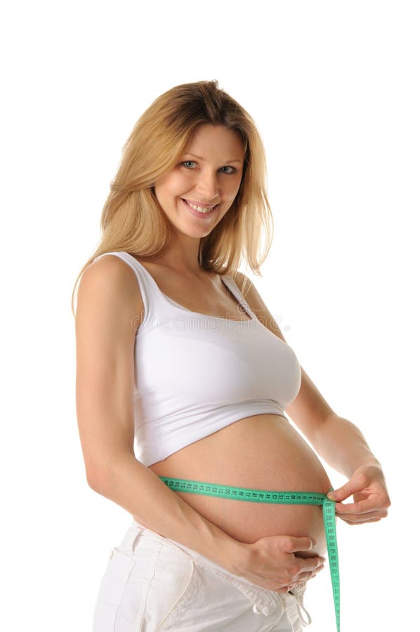 Happy pregnant woman belly measure