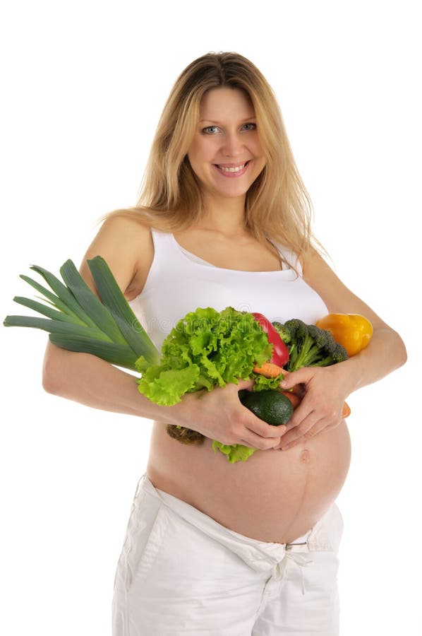 Happy pregnant woman with fruits and vegetables