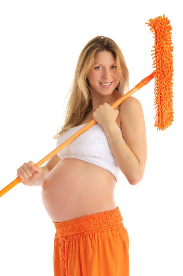 Happy pregnant woman with a mop and brush