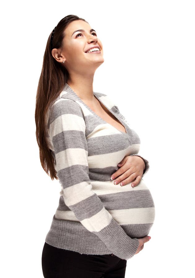 Happy pregnant woman touching her belly