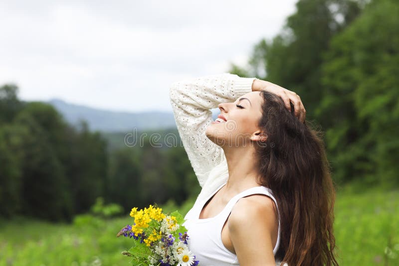 Happy pretty brunette woman in chamomile field royalty free stock photo Happy pretty brunette woman in chamomile field royalty free stock photo