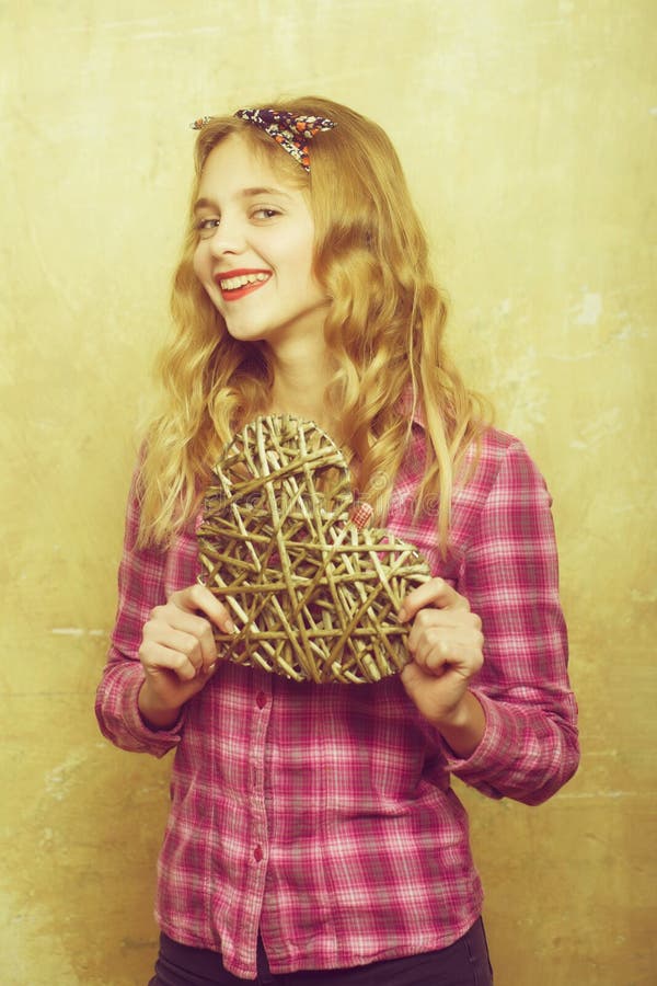 Happy pretty girl with wicker heart for valentines day royalty free stock photos Happy pretty girl with wicker heart for valentines day royalty free stock photos