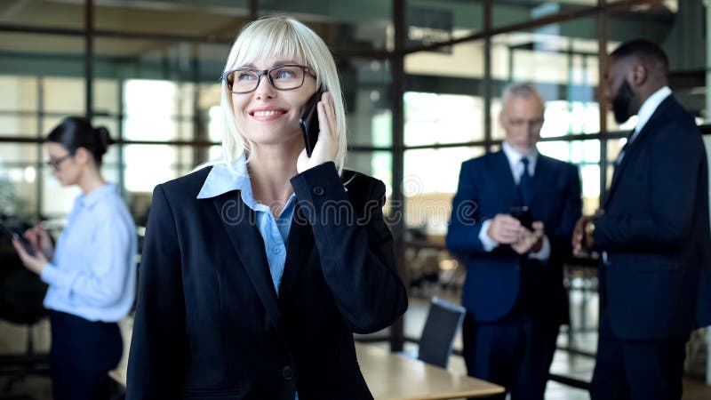 Happy pretty manager talking on phone, business mobile tariff, communication