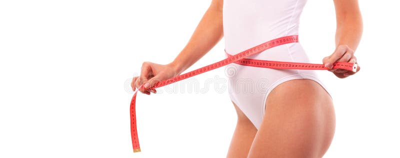 Happy pretty tanned woman with measure tape isolated on white background. Close up of sporty and beautiful female body. Healthy