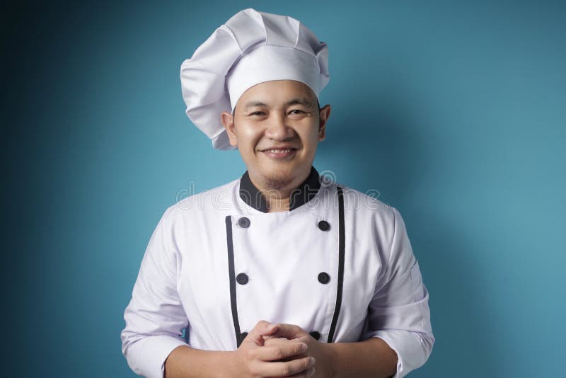 Happy Proud Asian Chef-glimlach bij camera stock foto's Happy Proud Asian Chef-glimlach bij camera stock foto's