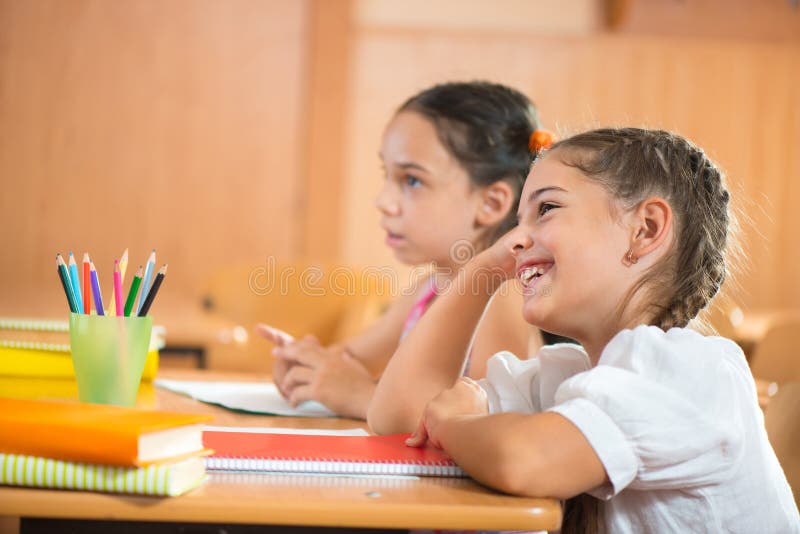 Happy pupils at school stock images