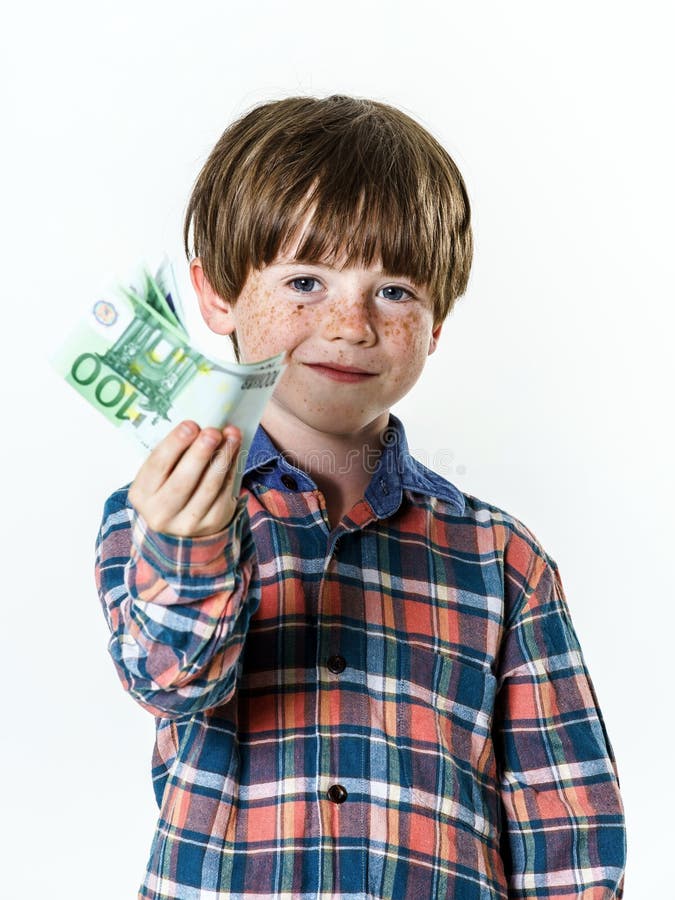 Happy red-haired boy with money