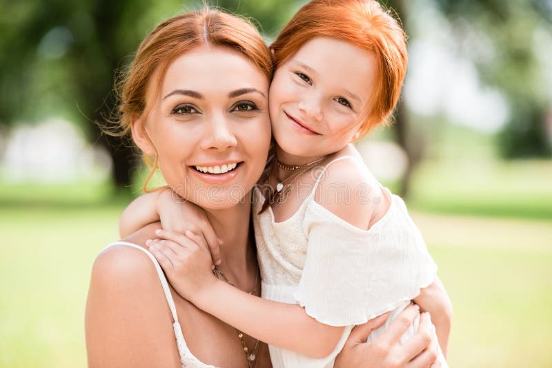 Mother and Daughter Hugging at Park Stock Image - Image of together