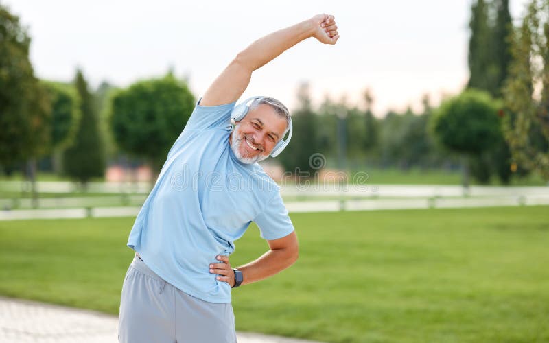 Happy Retired Senior Man Doing Side Stretching Exercises with Arm Overhead  during Outdoor Workout Stock Image - Image of exercising, active: 230305577