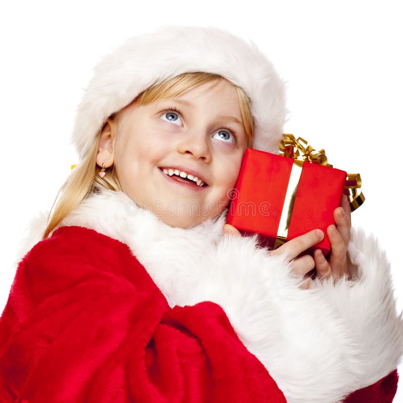 Happy santa claus child holds christmas gift