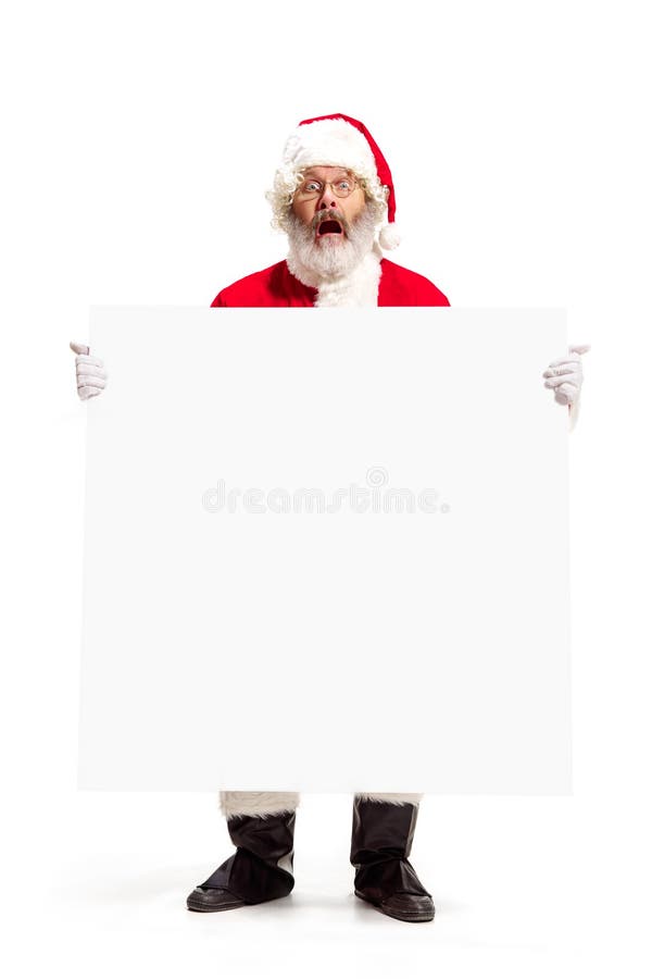 Happy Santa Claus pointing on blank advertisement banner background with copy space. Smiling Santa Claus pointing in