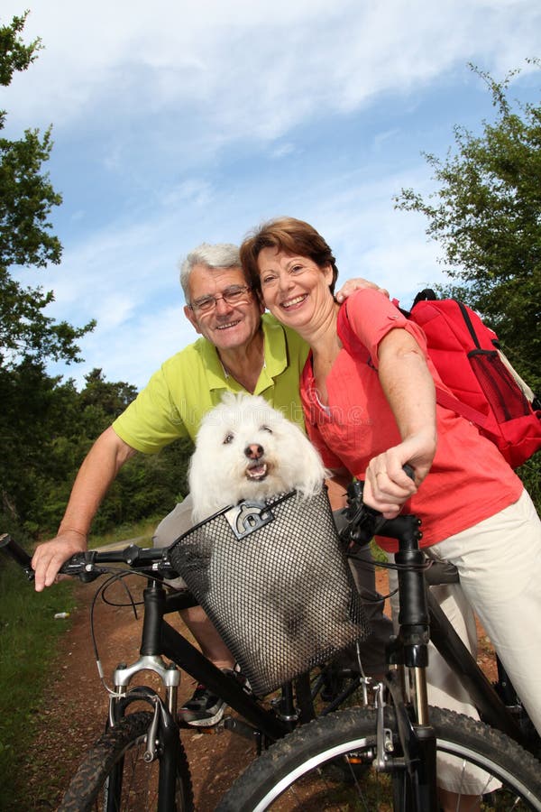 Happy senior couple on a bike ride