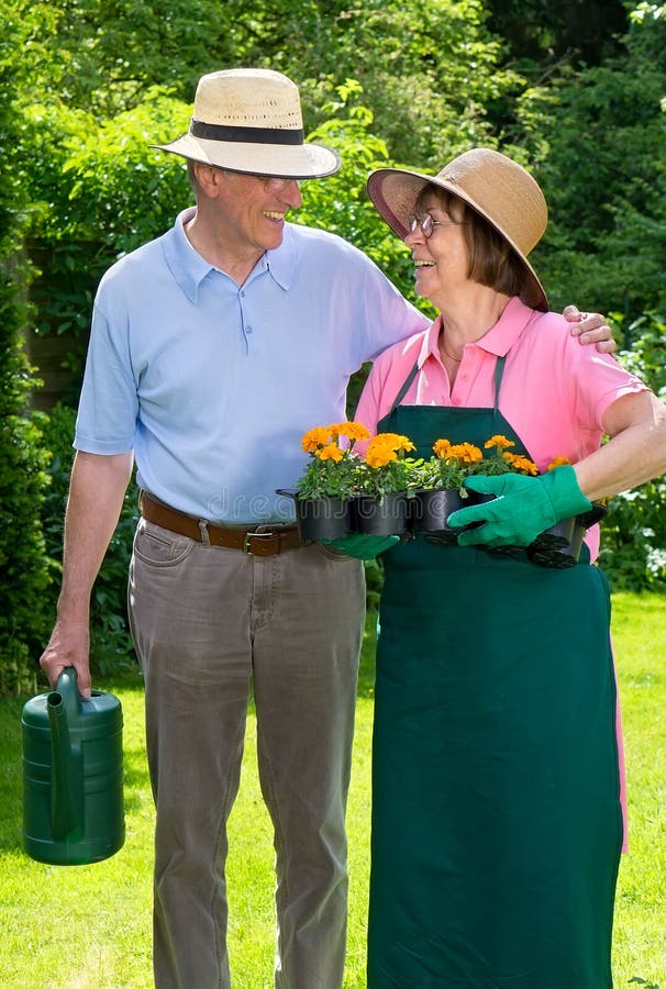 Happy Senior Couple in Garden Gazing at Each Other. stock image Happy Senior Couple in Garden Gazing at Each Other. stock image