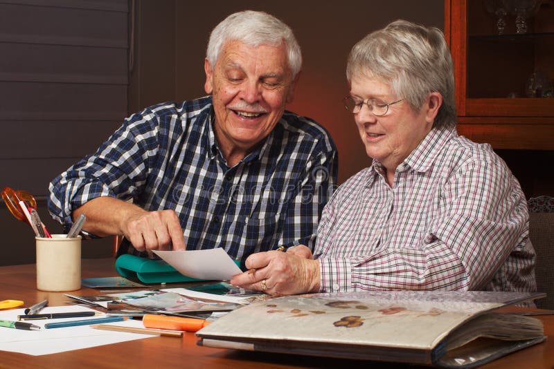 Happy Senior Couple Making a Scrapbook Stock Image Image of