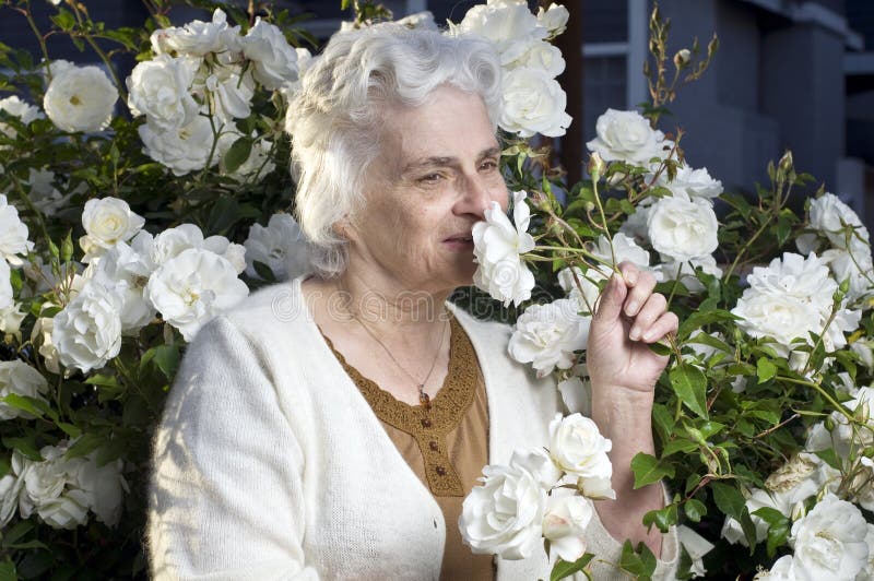 Happy senior lady in the garden