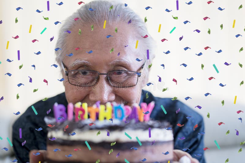 Happy senior man celebrating his birthday stock photos Happy senior man celebrating his birthday stock photos